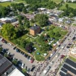 An aerial view of a busy neighbourhood festival or market
