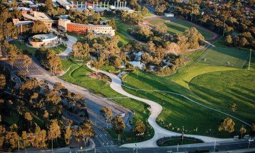 An aerial view of a university campus featuring modern academic buildings