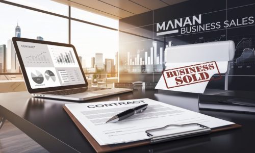 A wide-angle, low-angle shot of a modern office desk of MANAN BUSINESS SALES