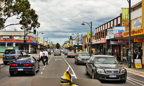 A street-level view of a busy commercial road in Preston Central